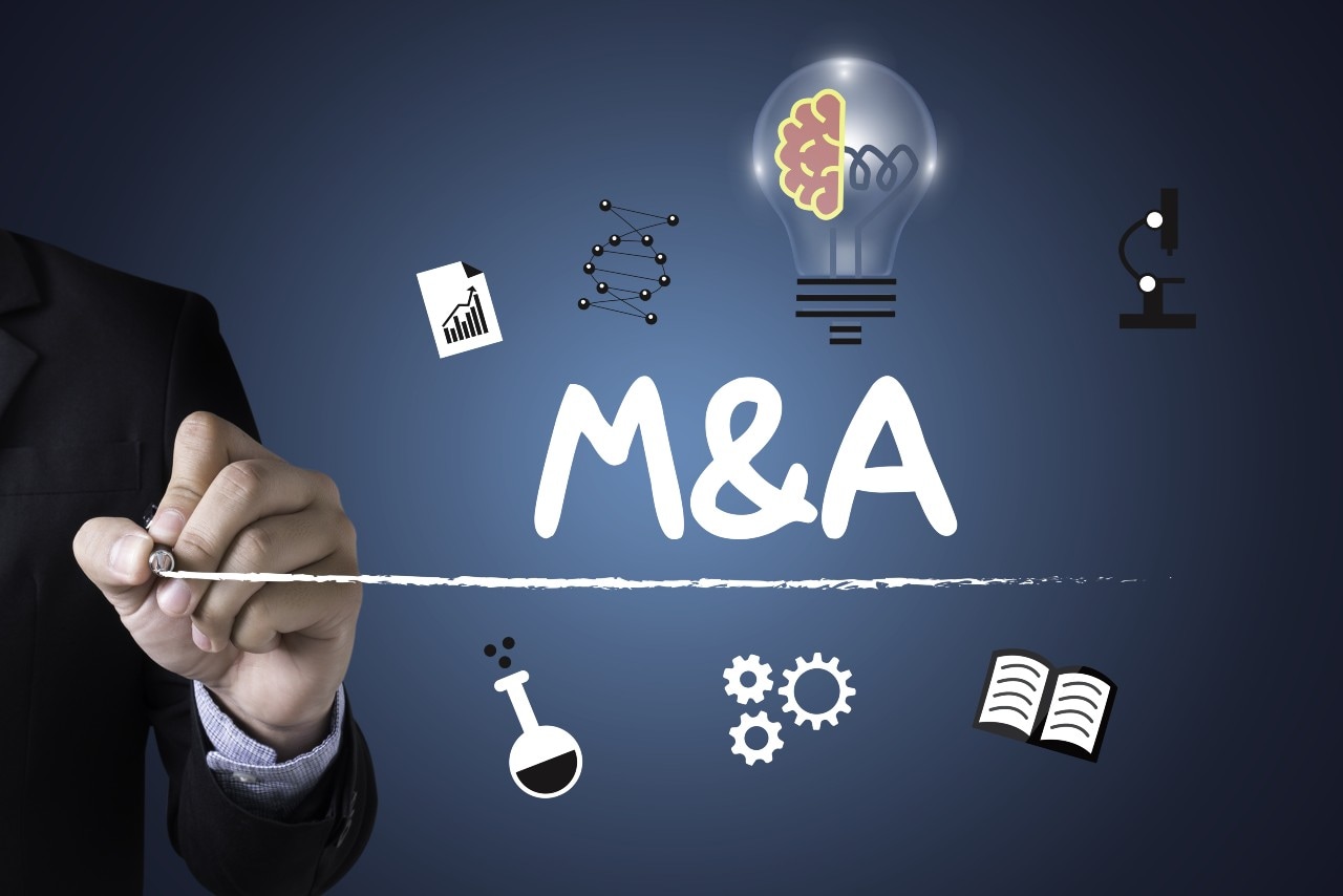 Bedrijfsovername, een M&amp;A (Mergers &amp; Acquisitions). Afbeelding: Shutterstock.
