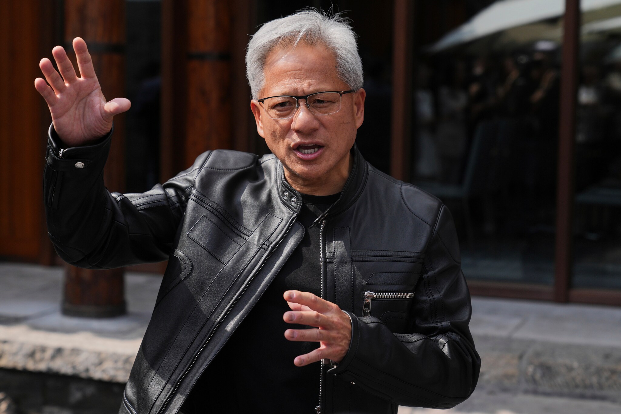 CEO of Nvidia Jensen Huang speaks during a press conference at the Mandarin Oriental Qianmen after attending the third China International Supply Chain Expo, in Beijing, Wednesday, July 16, 2025. (AP Photo/Andy Wong)  Nvidia-CEO Jensen Huang.