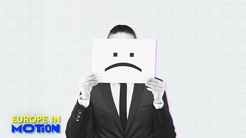 Een man met een ontevreden smiley door een slecht betaald loon Europe in Motion