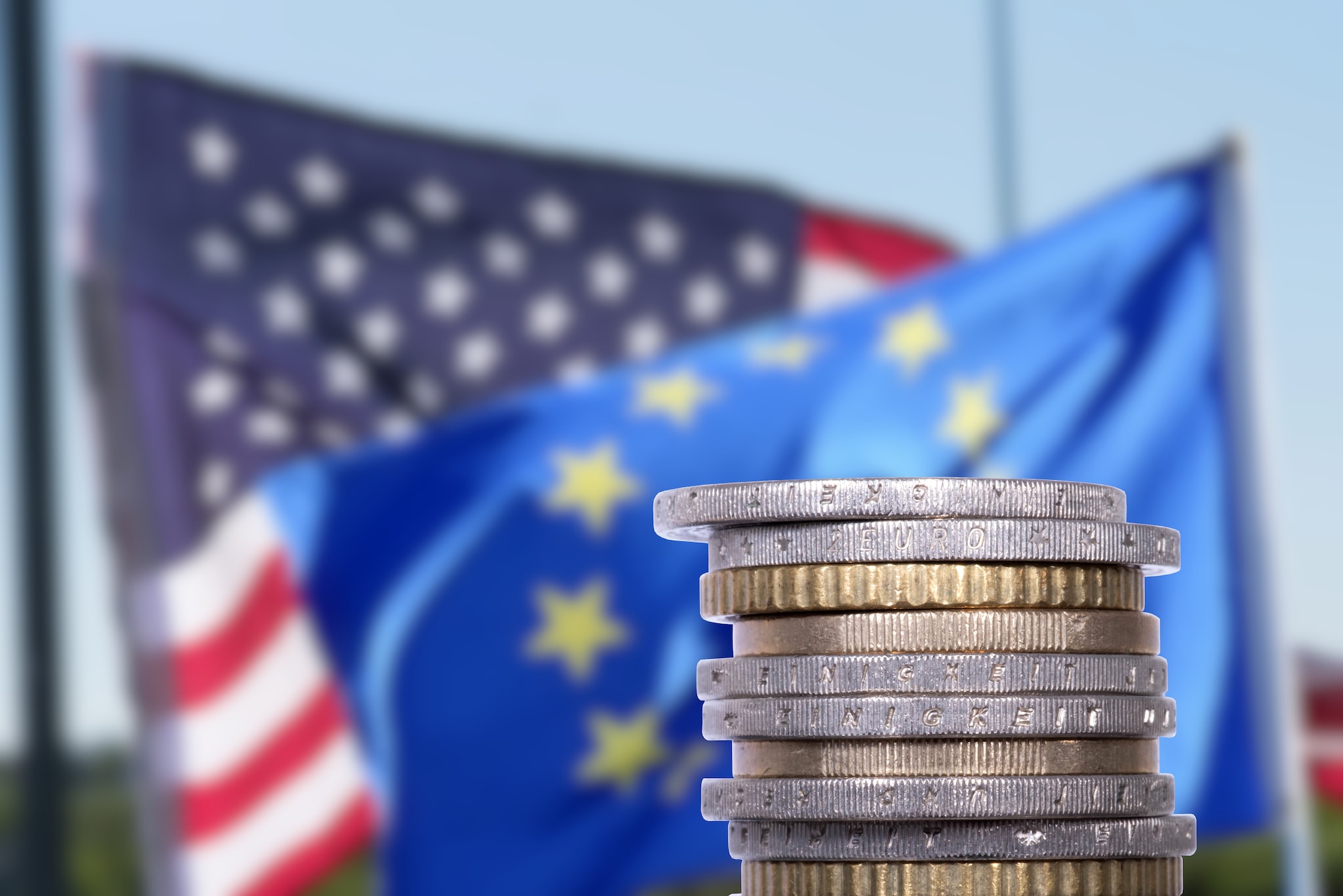 Flags of USA and European Union and Euro money Shutterstock