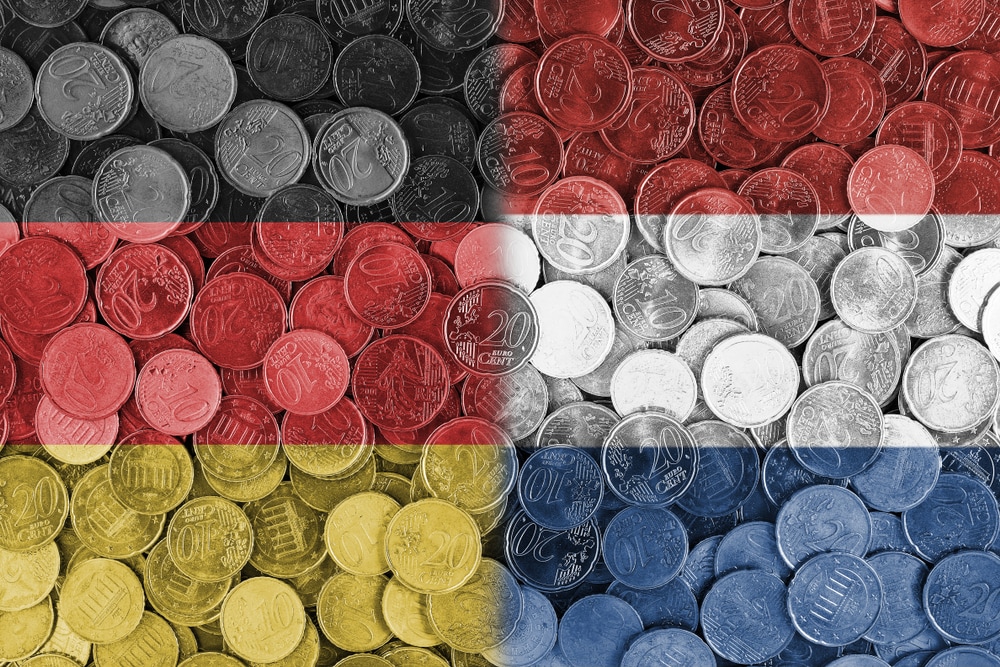 Economical relationship between Germany and Netherlands international trade of Germany, Holland, international trading, economics concept, investments, flags set on coin euros background Het handelsvolume tussen Nederland en Duitsland is over 2025 gegroeid met 3 procent. Zijn we bezig met een opwaartse trend? Shutterstock