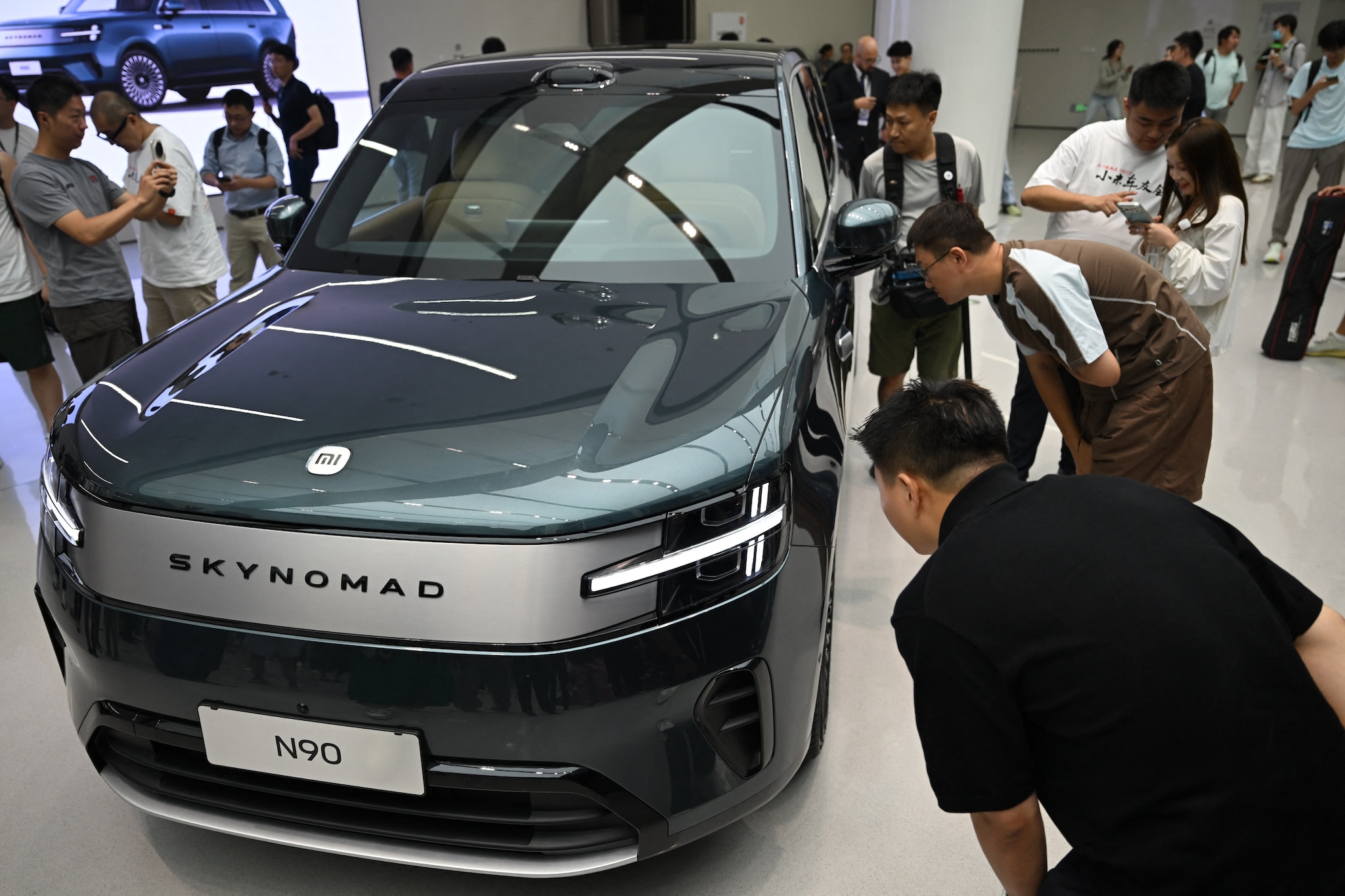 Presentatie van de Xiaomi Skynomad, een volledig elektrische familieuato, tijdens een autobeurs in Beijing.